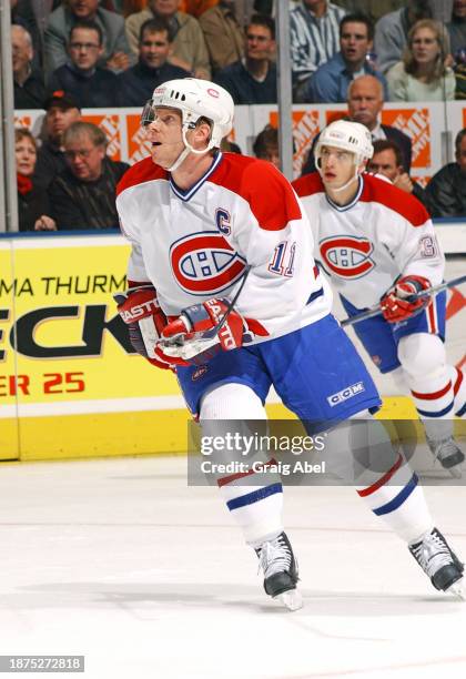 Saku Koivu of the Montreal Canadiens skates against the Toronto Maple Leafs during NHL game action on December 20, 2003 at Air Canada Centre in...