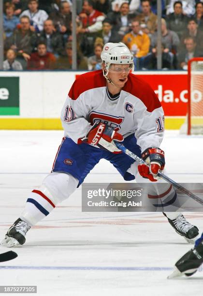 Saku Koivu of the Montreal Canadiens skates against the Toronto Maple Leafs during NHL game action on December 20, 2003 at Air Canada Centre in...