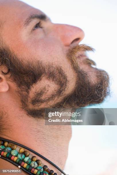 young man with beard in spiral shape - white bead stock pictures, royalty-free photos & images