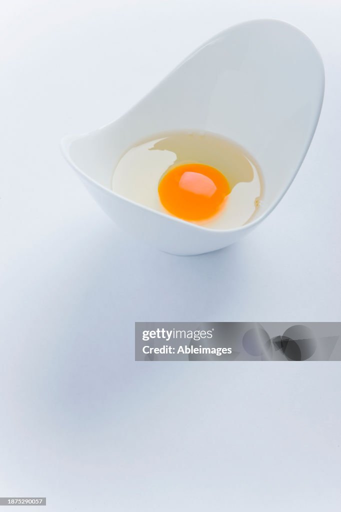 Uncooked Egg in White Container