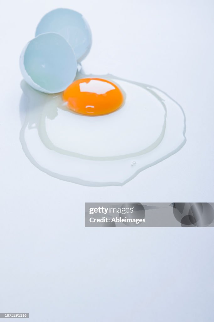 Broken Egg on white surface