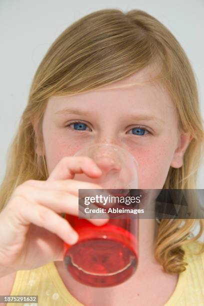 young girl drinking cranberry juice - superfood stock pictures, royalty-free photos & images