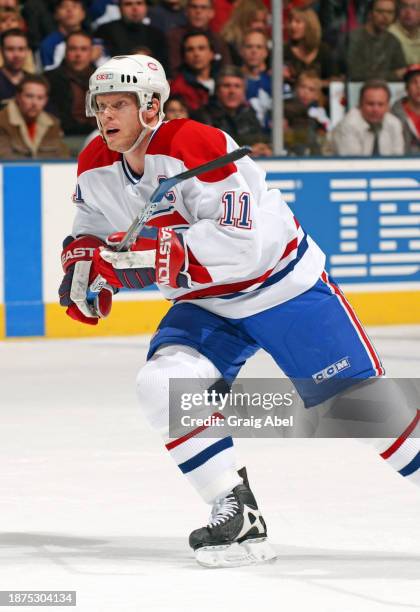 Saku Koivu of the Montreal Canadiens skates against the Toronto Maple Leafs during NHL game action on December 20, 2003 at Air Canada Centre in...