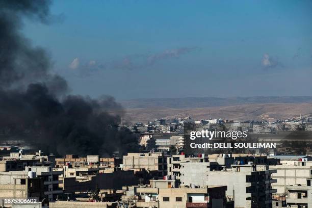 Smokes billows in Qamishli in northeastern Syria close to the Turkish border on December 25 amid Turkish military strikes in the area. Turkish air...