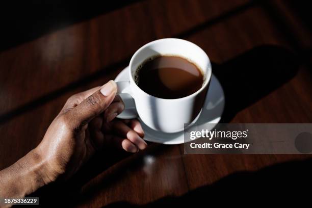 woman enjoys a coffee break - americano stockfoto's en -beelden