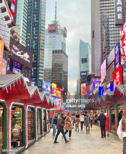 Pop-up Holiday market located in Times Square, New York City for residents and tourists to shop for holiday gifts and New York City souvenirs.