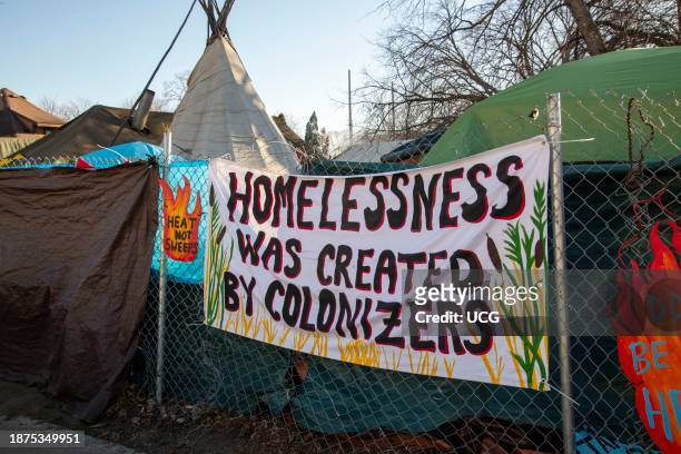 Minneapolis, Minnesota. Sign posted on the fence surrounding the homeless encampment in the East Phillips neighborhood. Minneapolis is prepared to...