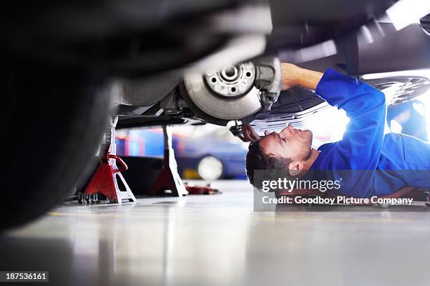 making sure it's 100 percent road worthy - repair garage stockfoto's en -beelden