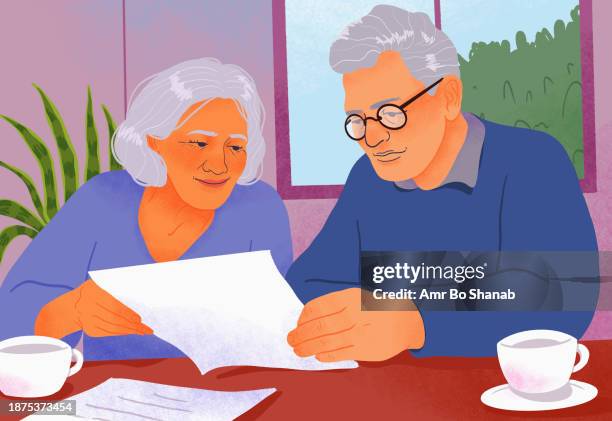 senior couple paying bills, reviewing paperwork at home - retirement stock illustrations