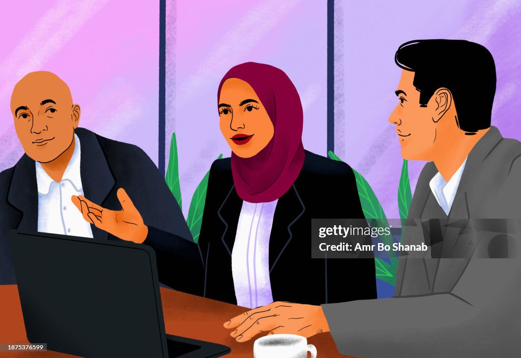 Businesswoman in hijab talking with colleagues in conference room meeting