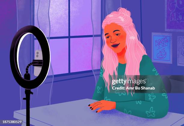 smiling female influencer filming behind ring light and smart phone at window - live event stock illustrations
