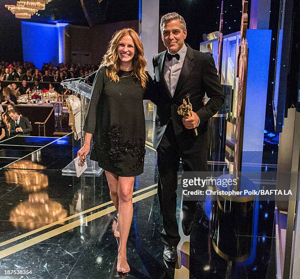 Honoree George Clooney , recipient of the Stanley Kubrick Britannia Award for Excellence in Film and actress Julia Roberts walk off stage during the...