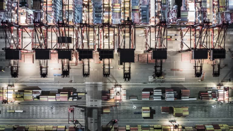 https://media.gettyimages.com/id/1875399306/video/hyper-lapse-aerial-view-of-industrial-port-with-containers-ship-at-night.jpg?b=1&s=640x640&k=20&c=4c5QmpBeL7hc3_9dxTZPxOGm7-kiuxIk6VwZqn0caWw=