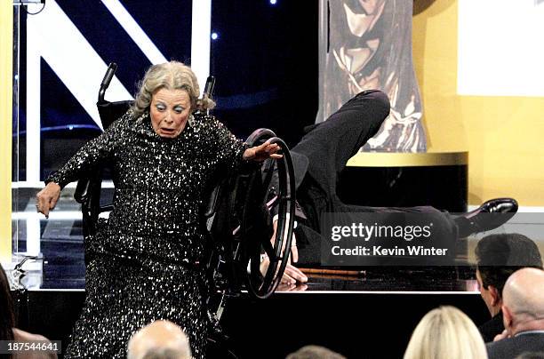 Actor Sacha Baron Cohen , recipient of the Charlie Chaplin Britannia Award for Excellence in Comedy and a stunt performer appear onstage during the...