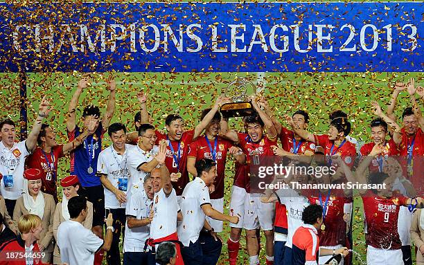 Guangzhou Evergrande players celebrate with the AFC Champions League Final Tropy after winning the 2013 AFC Champions League final at Guangzhou...