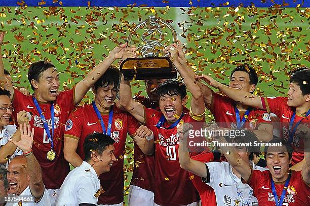 Guangzhou Evergrande players celebrate with the AFC Champions League Final Tropy after winning the 2013 AFC Champions League final at Guangzhou...