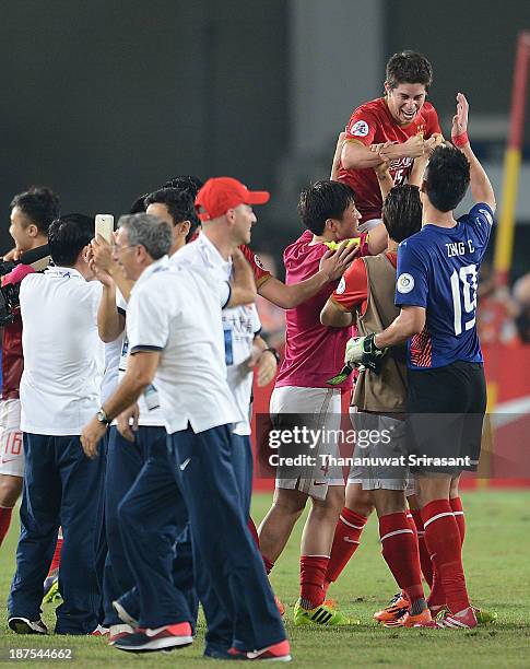 Guangzhou Evergrande player Dario Conca celebrates with team-mates after winning the 2013 AFC Champions League final at Guangzhou Tianhe Sport Center...