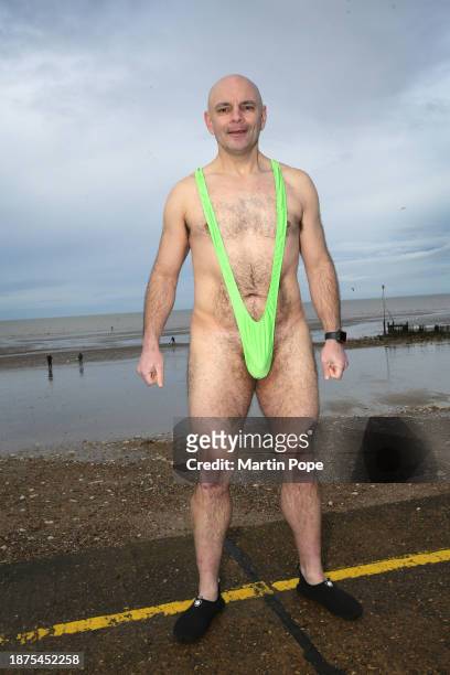 Ben Jones in his mankini prepares to join the charity swimmers on December 25, 2023 in Hunstanton, England. The traditional festive swim has a...