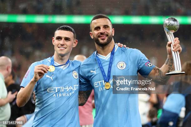 Phil Foden and Kyle Walker of Manchester City pose for a photo after the team's victory in the FIFA Club World Cup Saudi Arabia 2023 Final between...