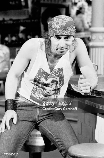 Portrait of American Blues & Rock musician Steven Van Zandt on a barstool during an interview on MTV at Teletronic Studios, New York, New York, May...