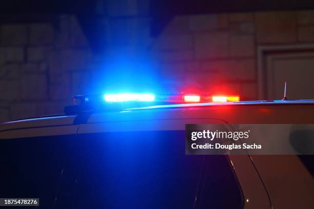 police interceptor vehicle with overhead light bar illuminated for a traffic stop - emergency light stock pictures, royalty-free photos & images