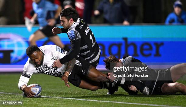 Bristol Bears player Virimi Vakatawa touches down to score the second Bears try despite the attentions of Falcons wing Mateo Carreras and Rory...