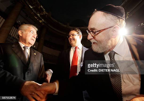 Austrian President Heinz Fischer is welcomed by the President of the Jewish congregation in Vienna Oskar Deutsch and the chief rabbi Paul Chaim...