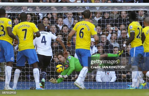 Newcastle United's Dutch goalkeeper Tim Krul makes a save from a Tottenham Hotspur's Icelandic midfielder Gylfi Sigurdsson free kick during the...