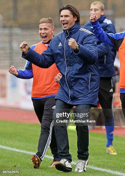 Head coach Thomas Brdaric of Neustrelitz jubilates after Velimir Jovanovic scoring the second goal during the Regionalliga Nordost match between...