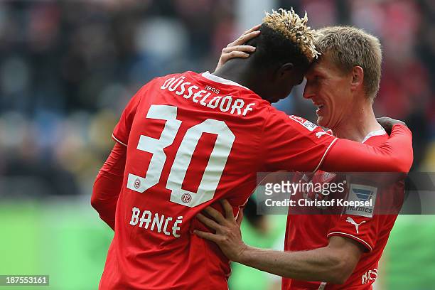 Aristide Bance of Duesseldorf celebrates the first goal with Axel Bellinghausen of Duesseldorf during the Second Bundesliga match between Fortuna...