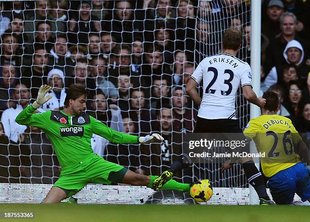 Tim Krul the Newcastle United goalkeeper makes a save under pressure from Christian Eriksen of Tottenham Hotspur during the Barclays Premier League...
