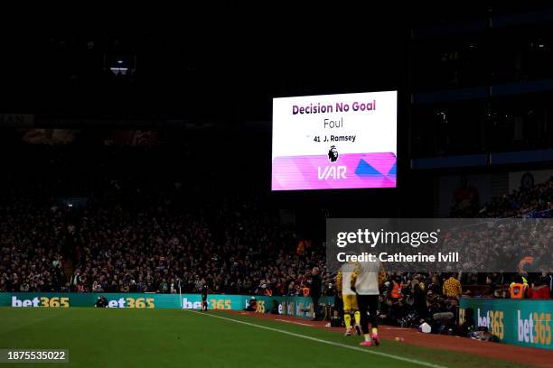 The LED board shows the message "decision no goal" after Match Referee Anthony Taylor checked the Video Assistant Referee screen before disallowing...