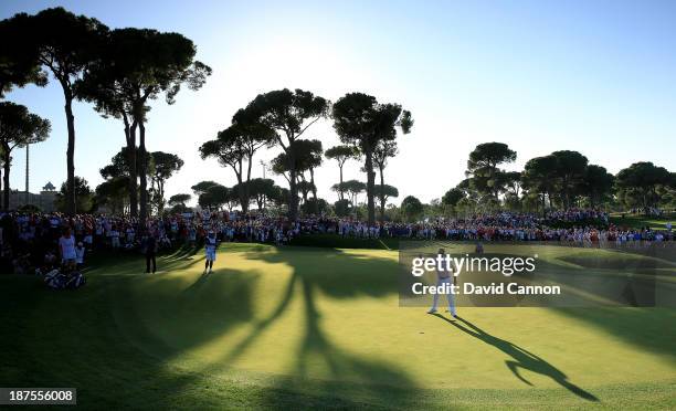 Victor Dubuisson of France celebrates after holing his birdie putt at the par 5, 18th hole to finish on a total of 24 under par and a two stroke...