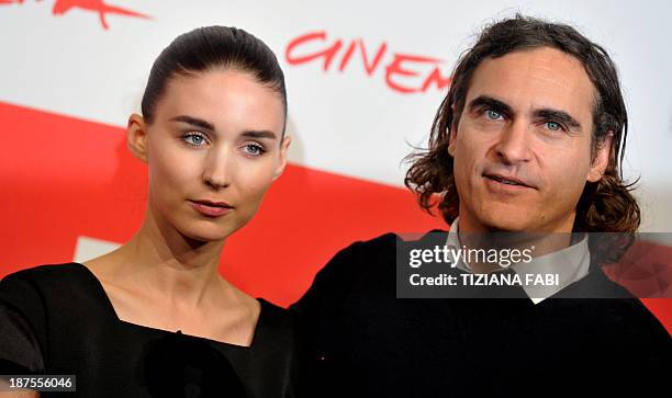 Actor Joaquin Phoenix poses with US actress Rooney Mara during the photocall of the fim "Her''on November 10, 2013 at the Rome International Film...