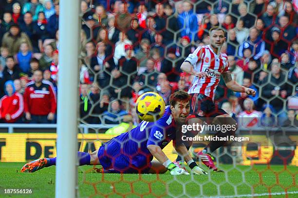 Phil Bardsley of Sunderland scores past Costel Pantilimon of Man City to make it 1-0 during the Barclays Premier league match bewtween Sunderland and...