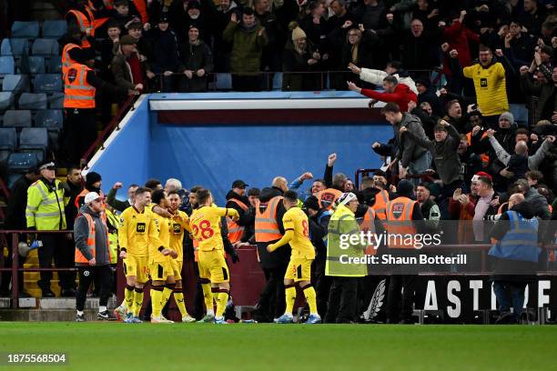 Cameron Archer of Sheffield United celebrates with teammates after scoring their team's first goal during the Premier League match between Aston...