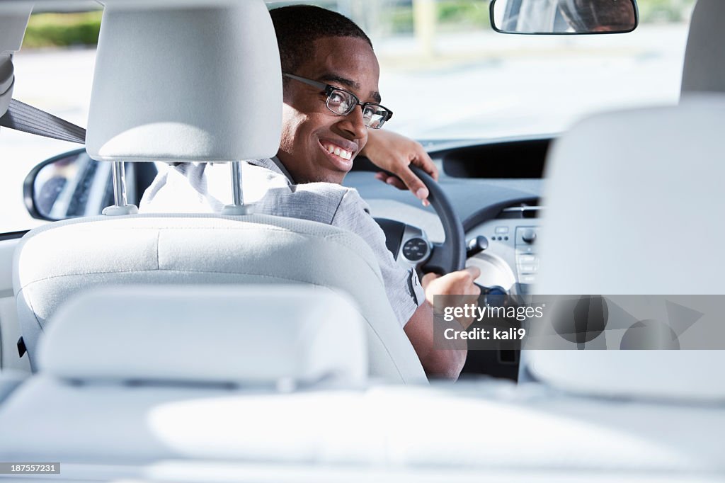 Young man driving car