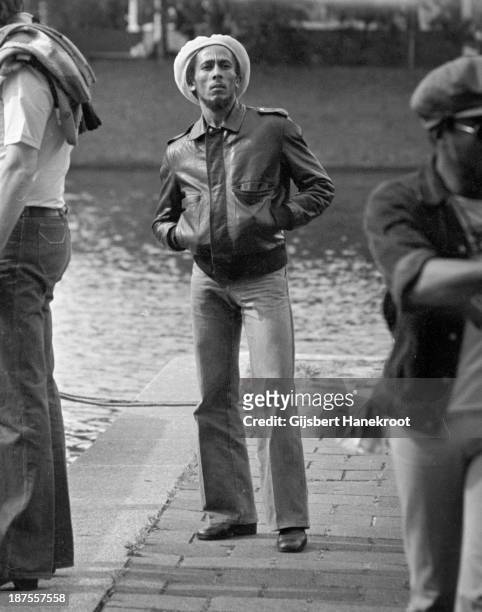 Jamaican reggae musician Bob Marley posed by the canal in Amsterdam, Netherlands in 1976.