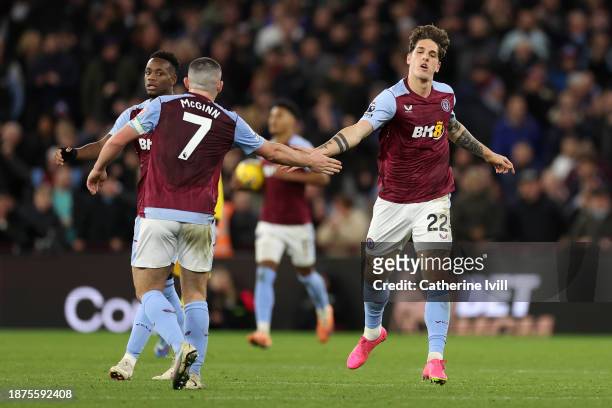 Nicolo Zaniolo of Aston Villa celebrates with teammate John McGinn after scoring their team's first goal during the Premier League match between...