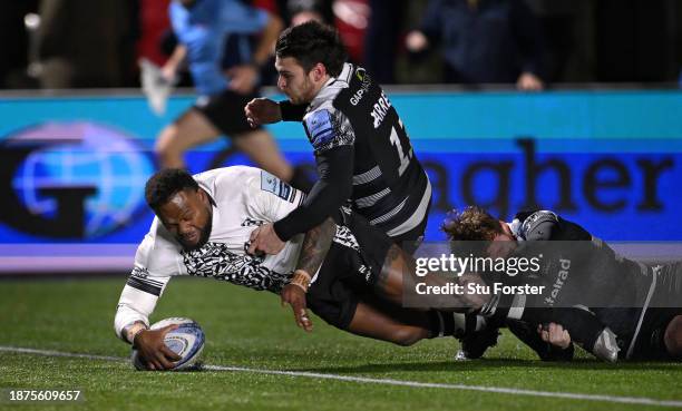 Bristol Bears player Virimi Vakatawa touches down to score the second Bears try despite the attentions of Falcons wing Mateo Carreras and Rory...