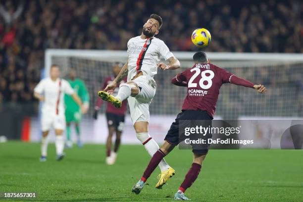 Olivier Giroud of AC Milan and Dylan Bronn of US Salernitana battle for the ball during the Serie A TIM match between US Salernitana and AC Milan at...