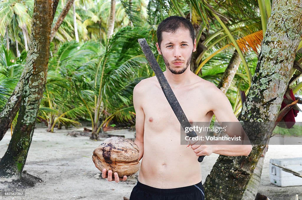 Man with a machete and a coconut