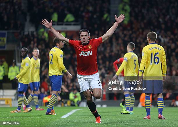Robin van Persie of Manchester United celebrates s oring their first goal during the Barclays Premier League Match between Manchester United and...