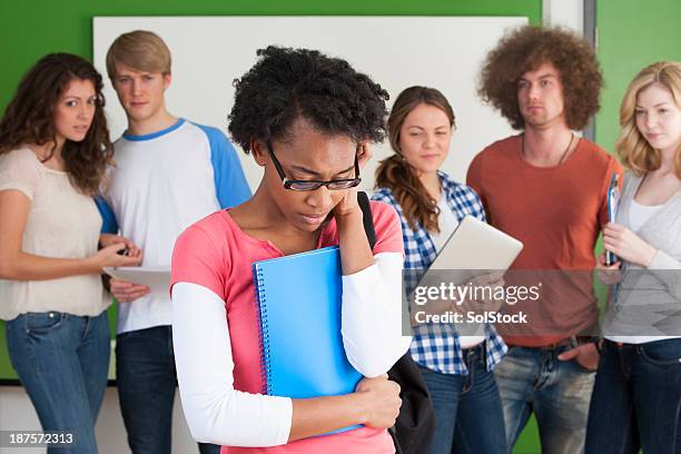 kicked from the group - vooroordeel stockfoto's en -beelden