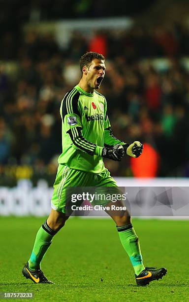 Asmir Begovic of Stoke City celebrates his sides equaliser during the Barclays Premier League match between Swansea City and Stoke City at Liberty...