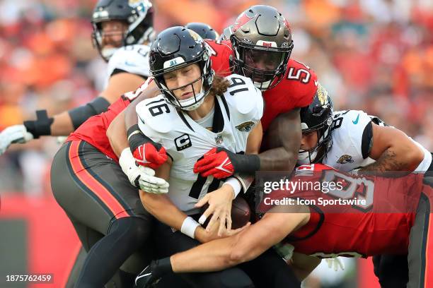 Tampa Bay Buccaneers Linebacker Lavonte David eyes Jacksonville Jaguars Quarterback Trevor Lawrence and then David wraps up Lawrence for the sack...