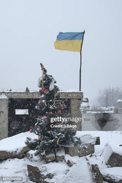 The military installed a Christmas tree at a destroyed checkpoint on a road which is constantly under fire from FPV drones on December 25, 2023 in...