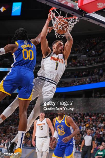 Michael Porter Jr. #1 of the Denver Nuggets dunks the ball during the game against the Golden State Warriors on December 25, 2023 at the Ball Arena...