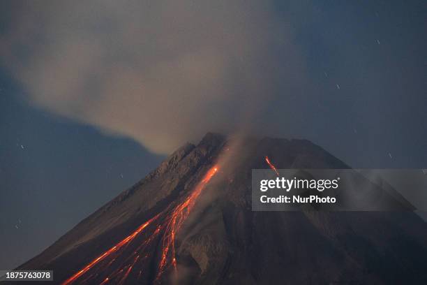 Mount Merapi volcano is spewing lava and smoke as seen from Tunggularum village in the Sleman district of Yogyakarta, Indonesia, on December 25,...