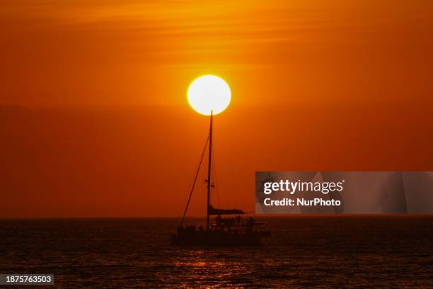 Yacht is sailing on the sea at sunset in Colombo, Sri Lanka, on December 25, 2023.